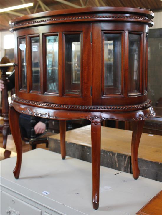 Oval mahogany glazed drinks cabinet